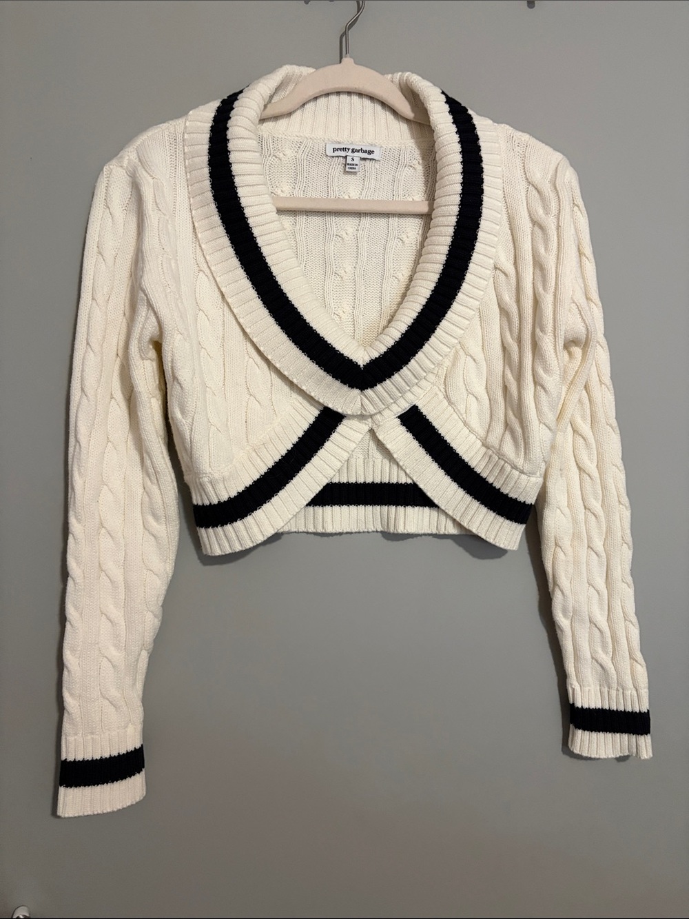 PrettyGarbage Cream Cable-Knit V-Neck Cropped Sweater with Black Trim